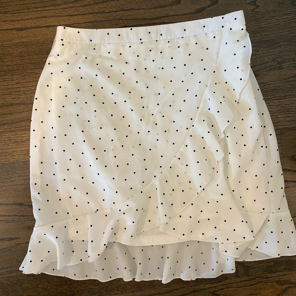 White mini skirt with black polka dots